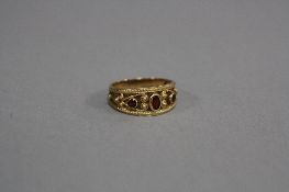 A LATE 20TH CENTURY 9CT GOLD GARNET ETRUSCAN STYLE DRESS RING, ring size Q1/2, hallmarked 9ct
