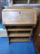 A SMALL OAK WRITING BUREAU, with shelves below