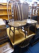 A SET OF FOUR ERCOL SPINDLE BACK DINING CHAIRS