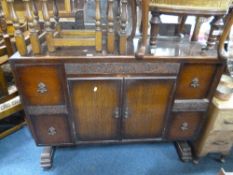 AN OAK MIRROR BACK SIDEBOARD