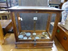 A SET OF GLASS CASED BALANCE SCALES, 'Philip Harris & Co Ltd, Birmingham label attached