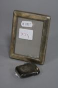 A SMALL SILVER VESTA, and a small silver frame (2)