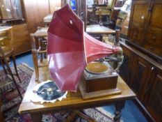 A WIND UP GRAMOPHONE, with horn and a small quantity of records (handle and needles)