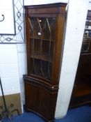 A MODERN MAHOGANY GLAZED CONCAVE CORNER CUPBOARD, (s.d)