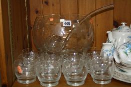 A GLASS PUNCH BOWL AND TWELVE GLASS CUPS, together with a glass ladle