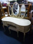 A CREAM AND GILT DRESSING TABLE, with triple mirrors and a stool (2)