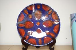 A LARGE POOLE POTTERY LUSTRE DISH, Volcano design, diameter approximately 41cm