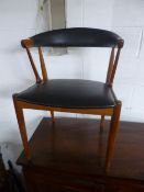 A PAIR OF TEAK FRAMED ARMCHAIRS