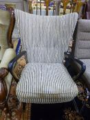 ARMCHAIR WITH STRIPED UPHOLSTERY, and an ebonised frame, 'H.K. for Howard Keith' label attached