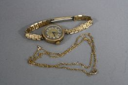 A 9CT GOLD WRISTWATCH AND A 9CT GOLD CHAIN, an early 20th Century ladies round case measuring