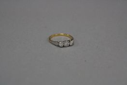 A LATE 20TH CENTURY THREE STONE DIAMOND RING, total round brilliant cut weight estimated 0.18ct,