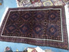 AN 'AUBERGINE' GROUND RUG, with geometric pattern, approximate size 206cm x 126cm