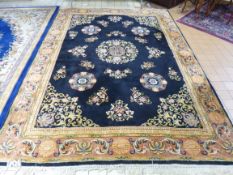 A BLACK GROUND CARPET, with terracotta boarder, approximate size 350cm x 250cm