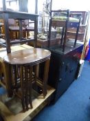 A MAHOGANY NEST OF THREE OVAL TABLES, and a piano stool (2)