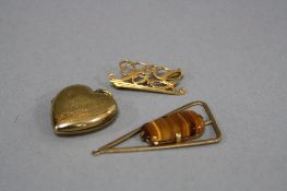 A COLLECTION OF PENDANTS, to include a 9ct gold back and front heart shape locket, a modern abstract