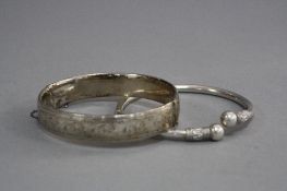 TWO SILVER BANGLES (2)