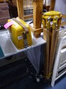 A CASED DUMPY LEVEL, with tripod stand