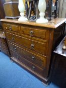A WALNUT CHEST, of two short and three long drawers