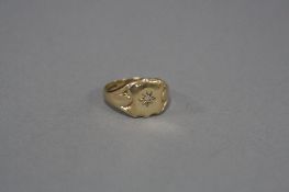 A MID TO LATE 20TH CENTURY 9CT GOLD DIAMOND SET SIGNET RING, one eight cut diamond star set to a