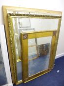 A LARGE MODERN GILT FRAMED WALL MIRROR, approximate size 143cm x 112cm and two other wall mirrors (
