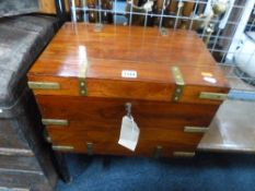 A HARDWOOD BRASS BOUND CHEST (key)