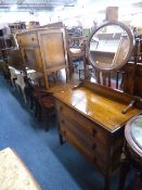 AN OAK FOUR PIECE BEDROOM SUITE, comprising of a mirror door wardrobe, dressing table, washstand and