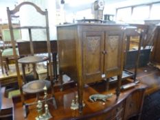 A SMALL OAK TWO DOOR CUPBOARD, an oak three tier folding cake stand and a hall stand (sd) (3)
