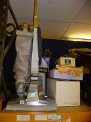 A KIRBY UPRIGHT VACUUM CLEANER, and accessories