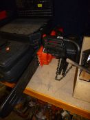 A BLACK AND DECKER ELECTRIC CHAINSAW, with spare parts