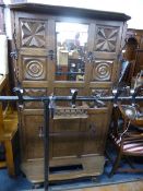 A FRENCH STYLE CARVED OAK HALL STAND, with wrought iron fitments (lacking drip tray)
