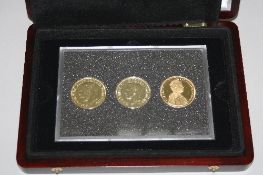 A THREE COIN HOUSE OF WINDSOR GOLD PLATED CROWN SET, boxed and certificate