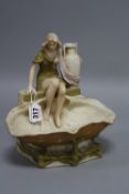 A ROYAL DUX PORCELAIN CENTREPIECE, seated maiden with jug by shell shaped pool, pink triangular mark