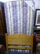 A PINE SINGLE BED, with mattress