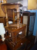 AN OAK NEST OF THREE TABLES, a small oak drop leaf occasional table and a mahogany single door china
