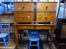A PINE SIDE TABLE, with two drawers and a matching pair of two drawer bedside cabinets