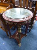 A MODERN CIRCULAR FRENCH STYLE TABLE, with inset top and metal mounts, approximate size diameter