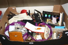 A BOX OF MIXED COSTUME JEWELLERY, gloves, purses, etc