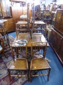 A SET OF FOUR NORTH COUNTRY SPINDLE BACK CHAIRS, with solid seats