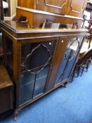 A MAHOGANY ASTRAGAL GLAZED TWO DOOR DISPLAY CABINET (sd)