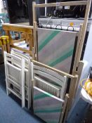 A WOODEN DECK CHAIR, with footstool and four painted folding chairs (6)