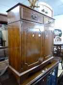 A YEW WOOD TWO DOOR CABINET, and a mahogany occasional table with undershelf (sd) (2)