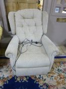 AN OATMEAL UPHOLSTERED ELECTRIC RECLINING ARMCHAIR