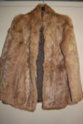 A FUR JACKET, size 16