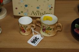 TWO MINIATURE ROYAL WORCESTER BLUSH IVORY ITEMS, to include tankard and loving cup, florally painted