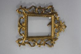 A LATE VICTORIAN GILT METAL PHOTOGRAPH FRAME, foliate scroll, inner dimensions, 14cm x 9.5cm