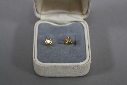 A PAIR OF 18CT DIAMOND STUDS