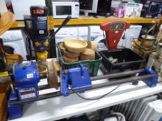A RECORD POWER DML 24X TABLE TOP LATHE, with two boxes of accessories and wood items