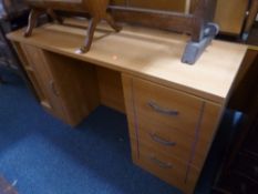 A MODERN DESK, with three drawers