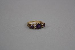 A LATE 20TH CENTURY AMETHYST AND CULTURED SPLIT PEARL HALF HOOP RING, three round mixed cut