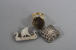 TWO CELTIC SILVER BROOCHES, and a quartz silver ring (3)